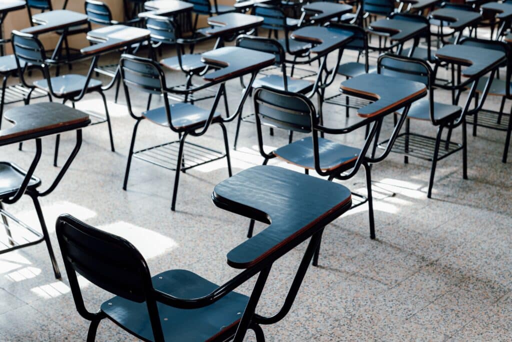 Why trust in school leadership matters in South African primary schools Rows of empty desks in a bright Buenos Aires classroom, symbolizing education and learning environment.